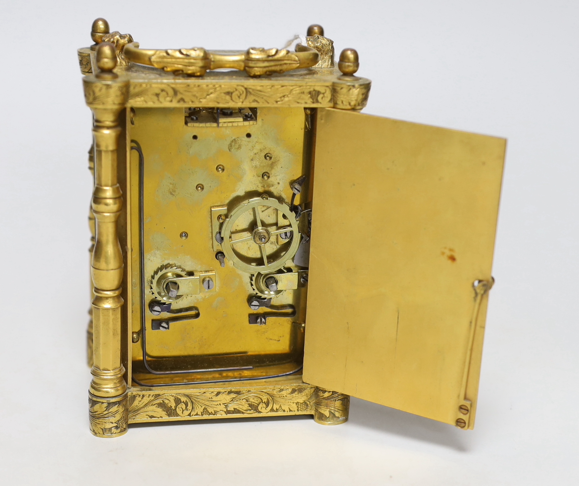 A mid 19th century French engraved gilt brass carriage clock, with tooled leather case, 16cm high